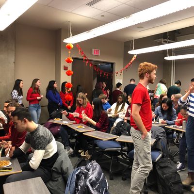 Students enjoying Chinese food at the Chinese Spring Festival.