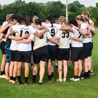 An ultimate team gathered in a huddle