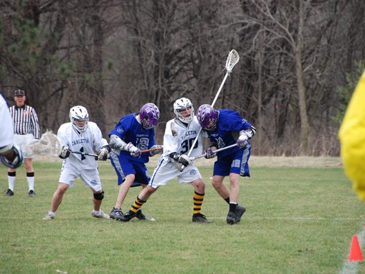 Members of club lacrosse playing in a game