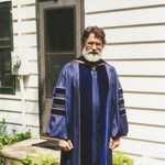 Mark Hansell poses in his academic robe.