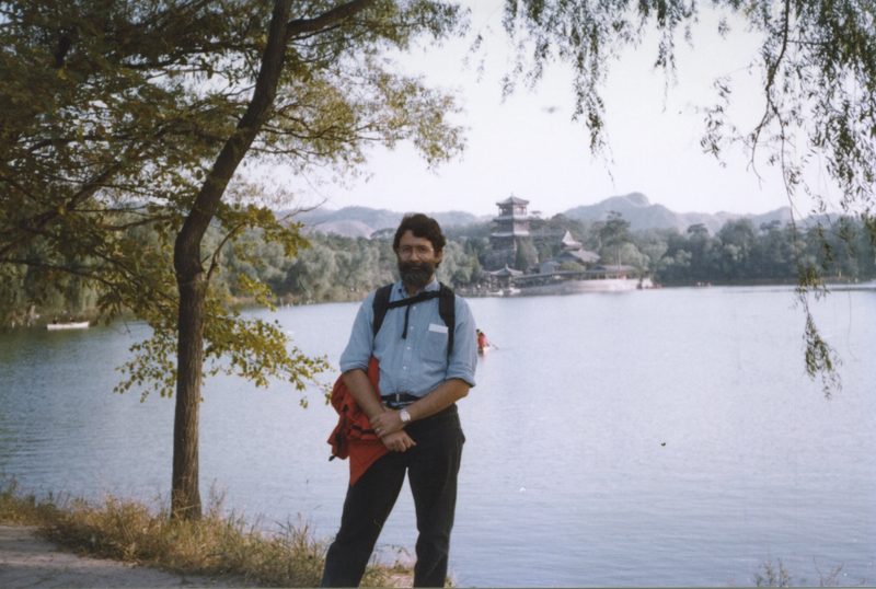Mark posing by a lake in China