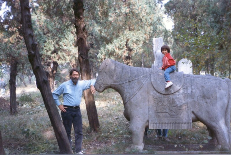 Mark posing with his young daughter.