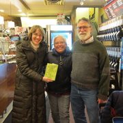 Brigid, Teri and Mark posing with Practical Chinese Reader Text