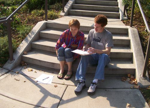 two students on a sunny stairway