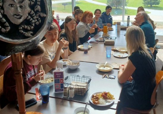 students and faculty eating lunch together
