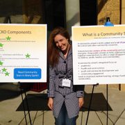 Kathryn Lozada (Class of 2012) with posters about Greenvale Park Community School.