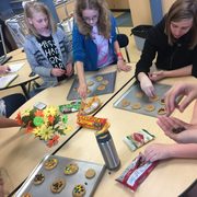 Girls from Northfield Middle School decorate cookies one week during a Girls Circle meeting.