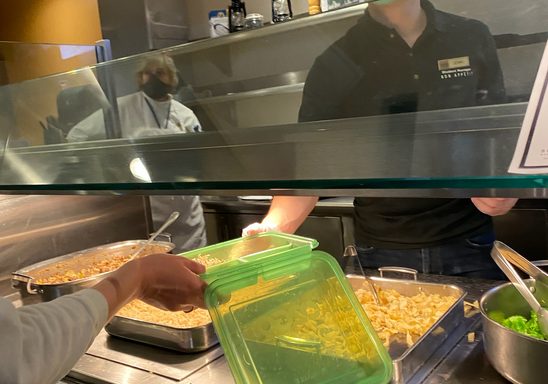 Filling a G2G container at a food station