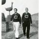 Jack Caton ’40 and Paul Clifford Domke ’40 walk along the mission wall.