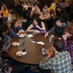 Professor Deborah Appleman with students at a Chili night about issues facing undocumented students