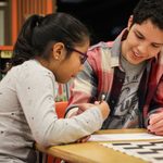 Daniel Quintero '20 works with a Greenvale student during homework help hours