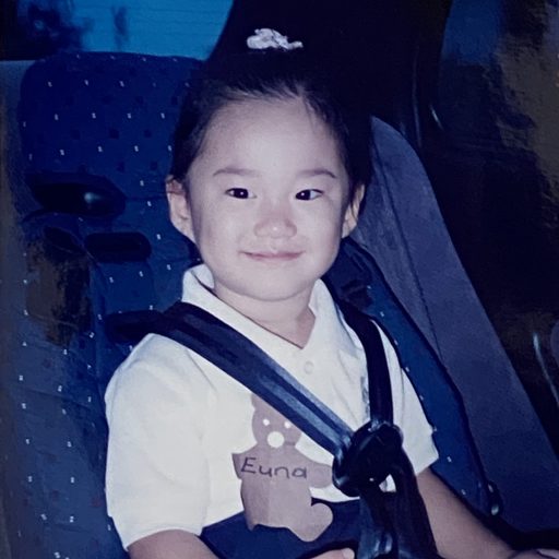 Smiling child in a car seat