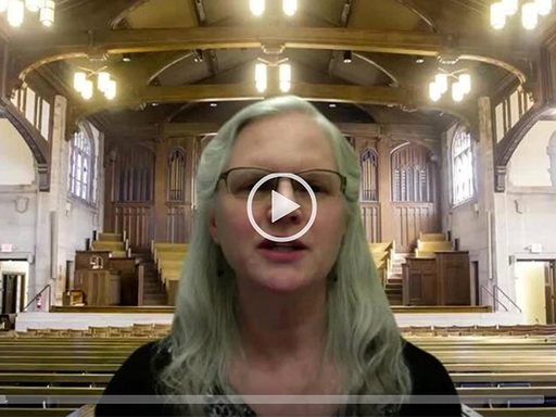 a woman speaks in an empty chapel