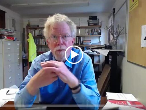 A professor at his desk