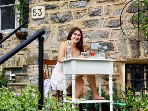 student at an outdoor desk