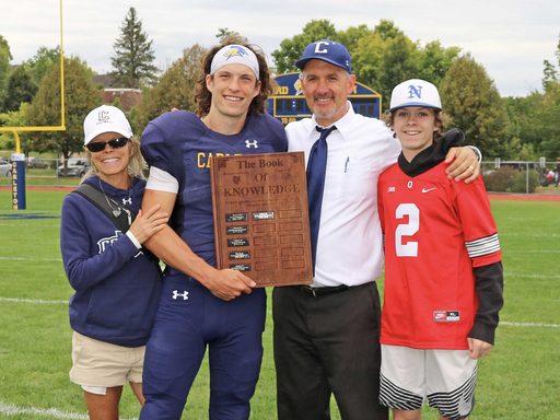 athletic family on a sportball field