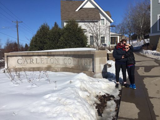 people hugging on a winter sidewalk