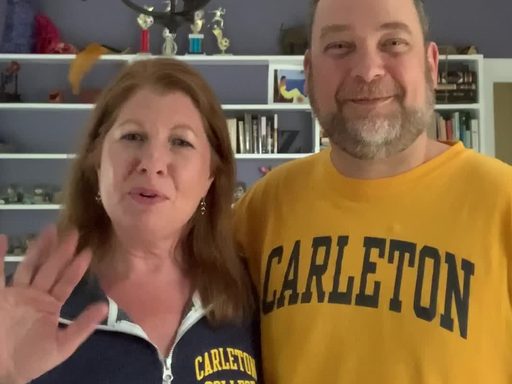parents wave to a video camera