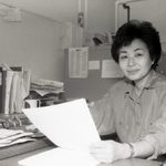 Mariko seated in her Scoville office
