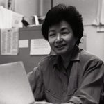 Mariko seated in her Scoville office.