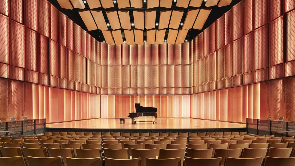 A piano on the stage at Kracum Performance Hall.