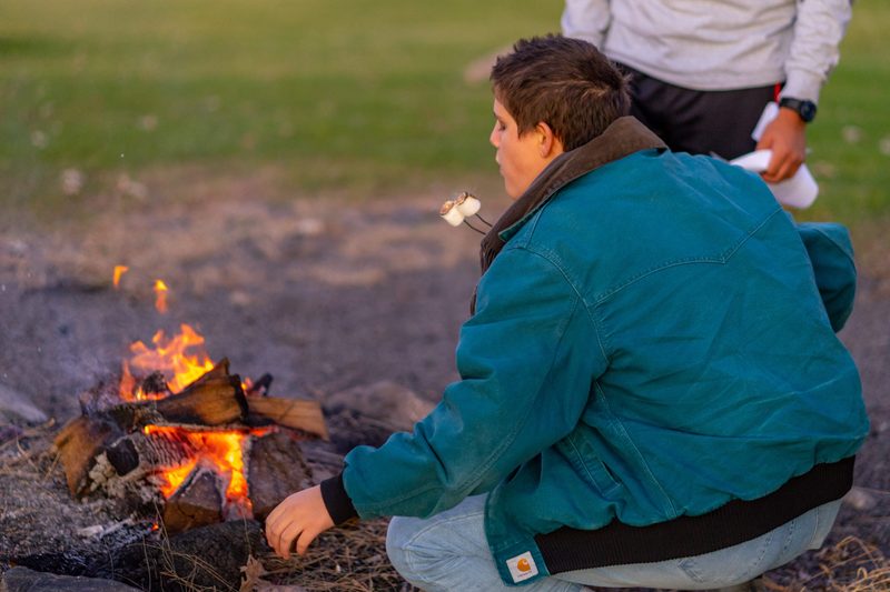 The Class of 2023 gathers for a bonfire on the Hill of Three Oaks on Friday, Oct. 25, 2019.