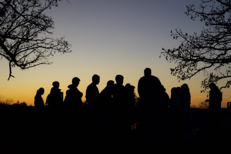 The Class of 2023 gathers for a bonfire on the Hill of Three Oaks on Friday, Oct. 25, 2019.