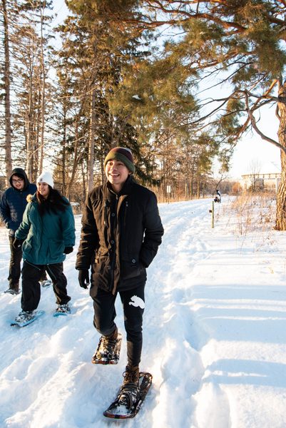 Students snowshoe in the arb