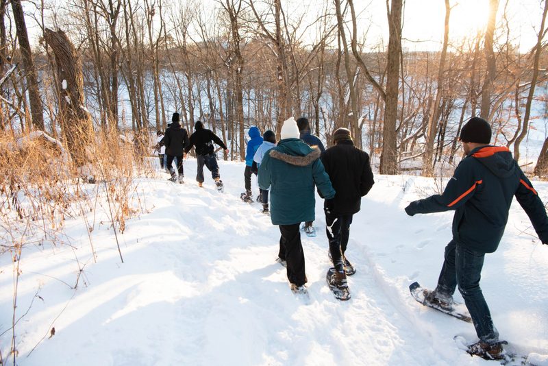 Students snowshoe in the arb