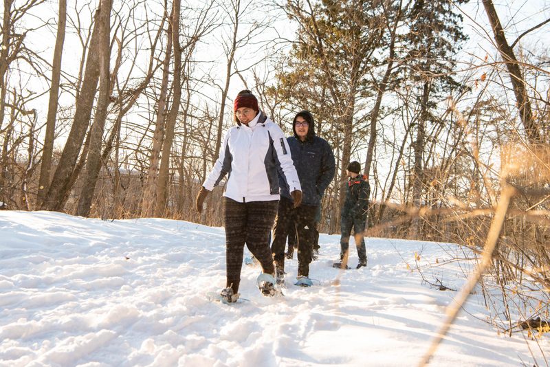 Students snowshoe in the arb