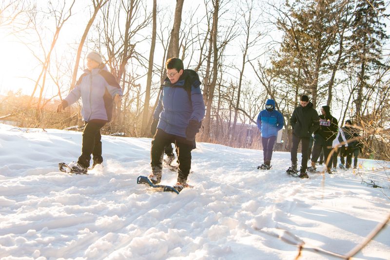 Students snowshoe in the arb