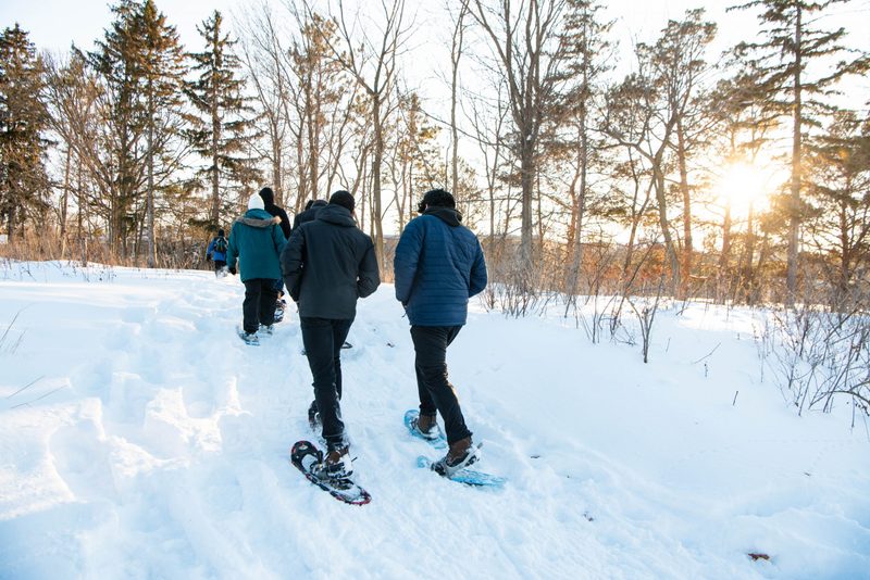 Students snowshoe in the arb