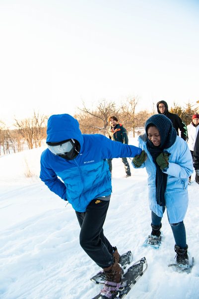 Students snowshoe in the arb