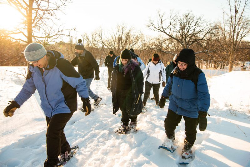 Students snowshoe in the arb