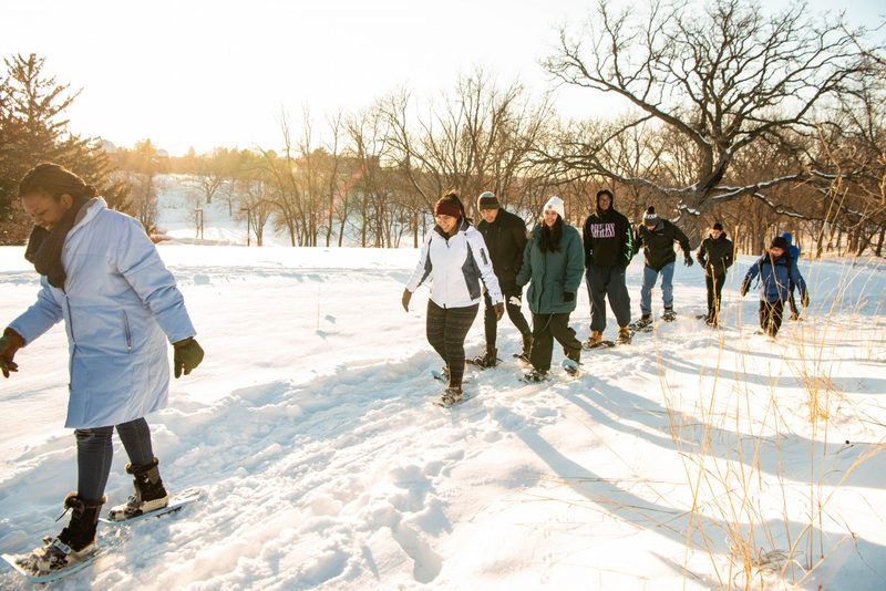 Students snowshoe in the arb