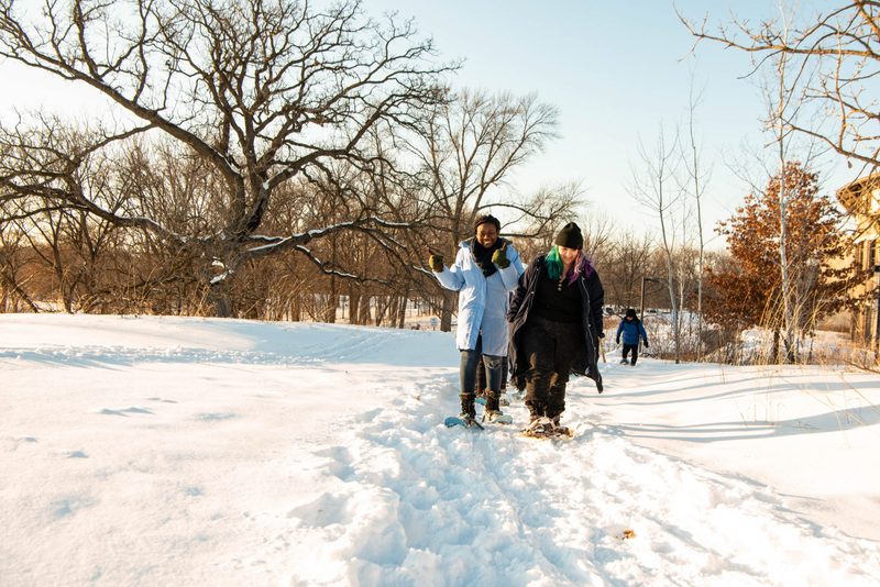 Students snowshoe in the arb