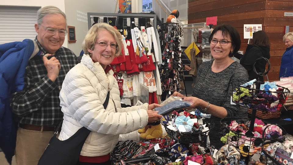 History professor emeritus Cliff Clark & his wife Grace shop at the 2018 holiday craft fair.