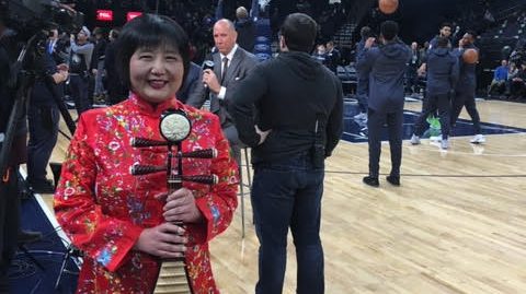 Image of Gao Hong as she waits to perform the national anthem at Target Center.