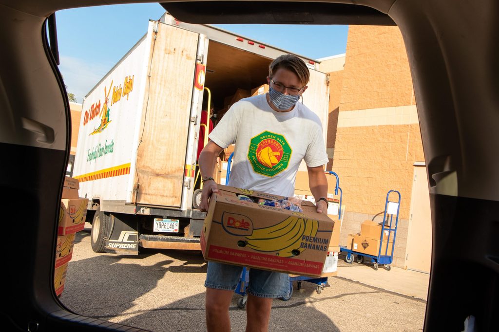 Jack Johnson ’21 loading recovered food to be transported to the CAC Food Shelf