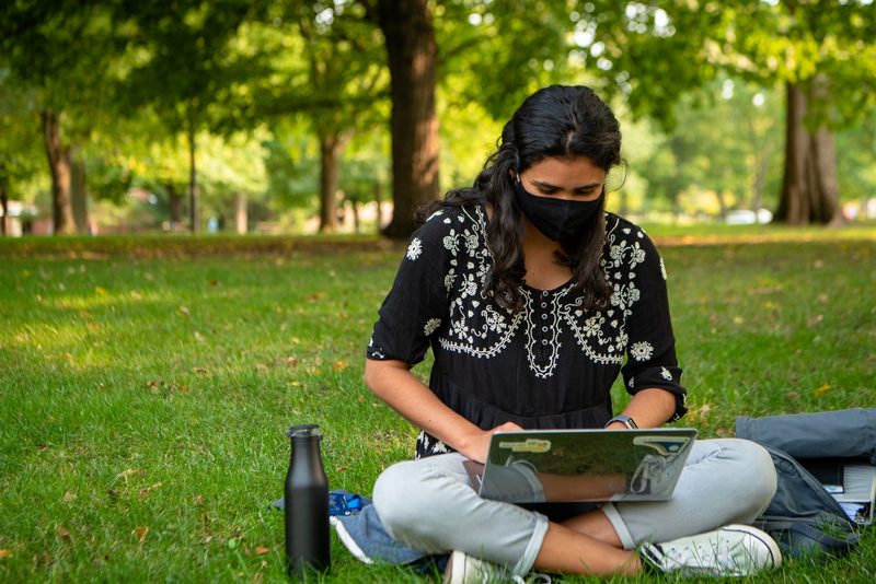 Student studies outside