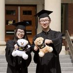 two graduates with 