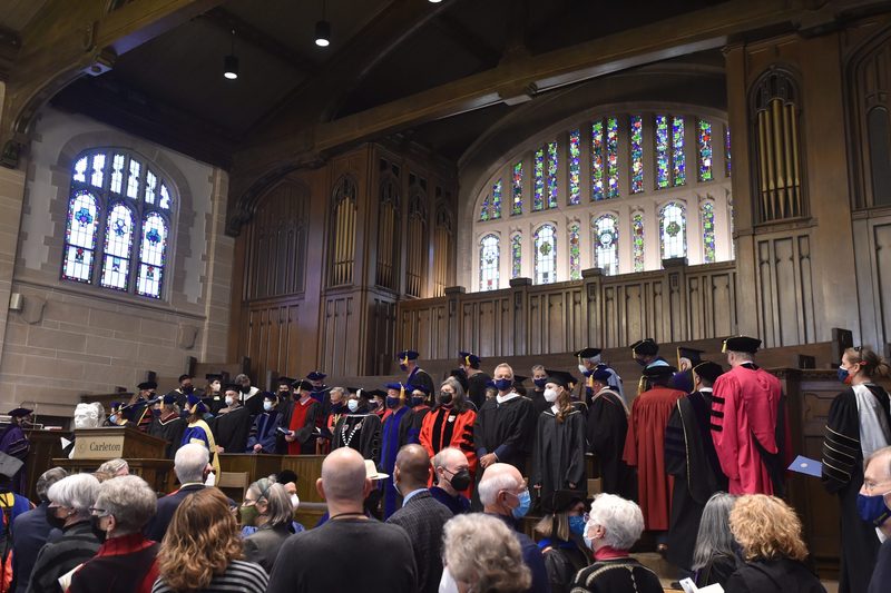 A full chapel view with faculty and the pulpit.