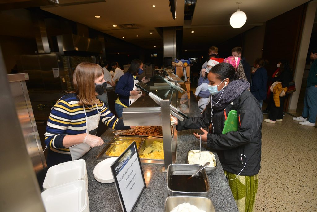 Byerly serving Late Night Breakfast to students.