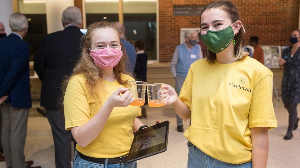 Two Carls cheers-ing their special beaker cups at the Science Center Dedication.