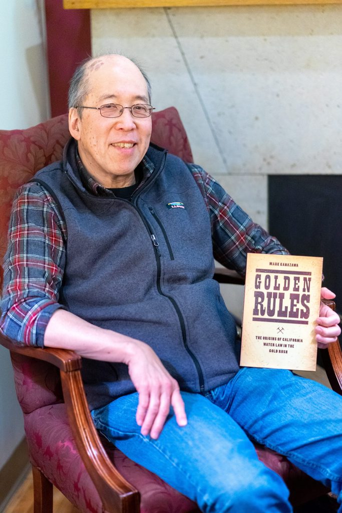 Mark Kanazawa poses with his book