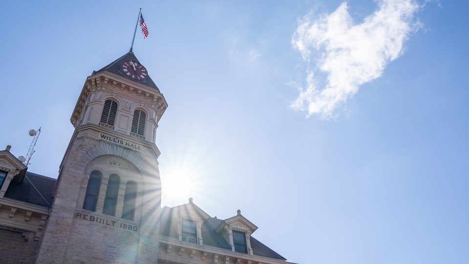 Willis Hall with the sun behind it
