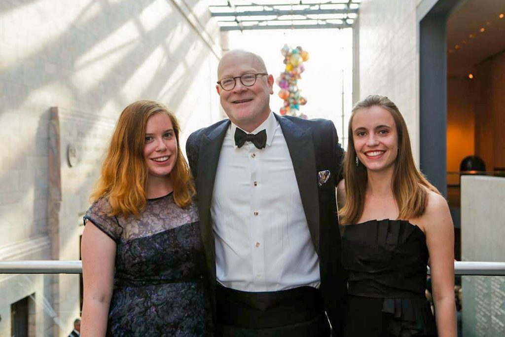 Eleanor Dollear '16, Jack Becker '86 and Sophie Buchmueller '16 in evening dress at the Joslyn Art Museum in Omaha.