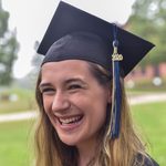 Sophia Maymudes '20 smiles at the camera in her graduation cap.