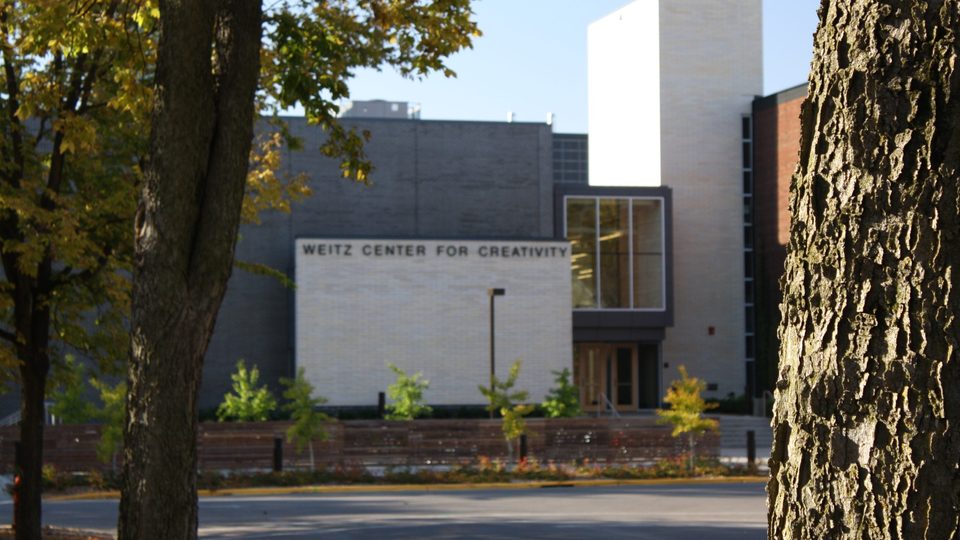 Photo taken from afar of the front of the Weitz Center building.