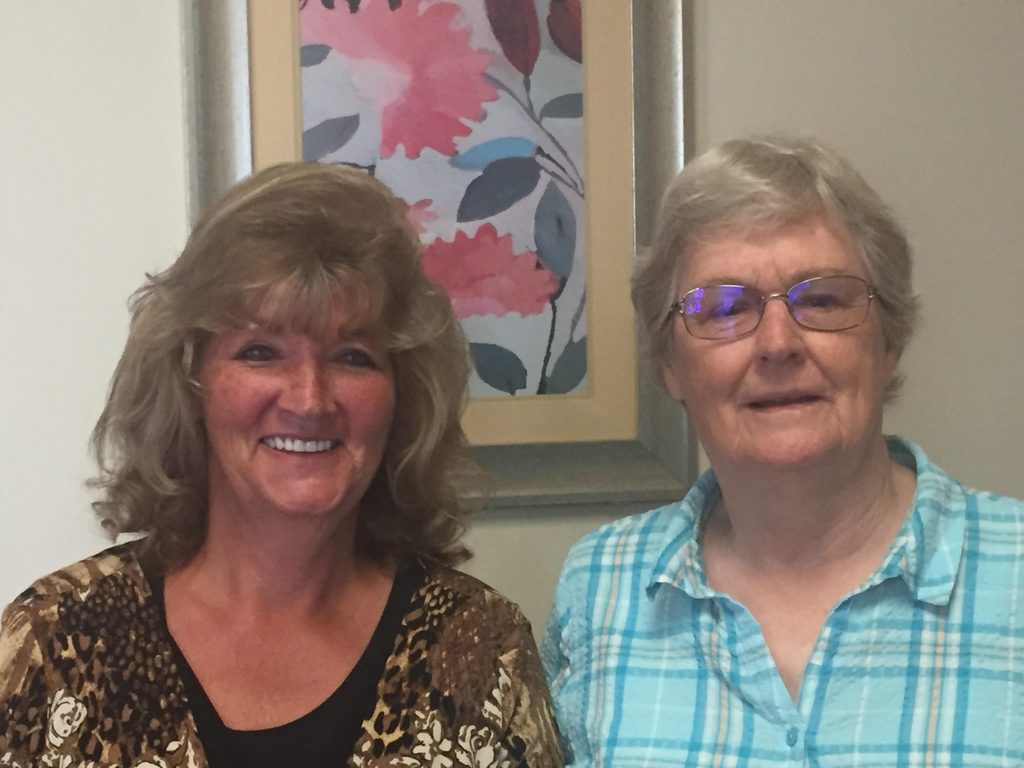 Loretta Springer and Pat Flynn pose for the camera, smiling.